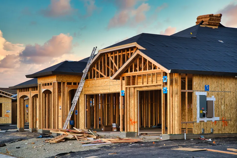 Wood-frame houses under construction.